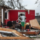 James Sonya surveys what is left of his uncles barber shop after Hurricane Laura passed through the area on August 27, 2020 in Lake Charles, Louisiana.